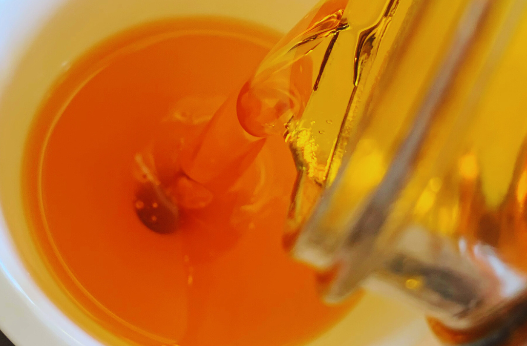 Bright orange herbal infused oil